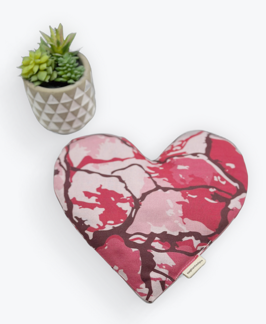 red pink, light pink and brown colored tie dye fabric heart shaped eye pillow